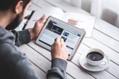 Worker-reading-news-with-tablet