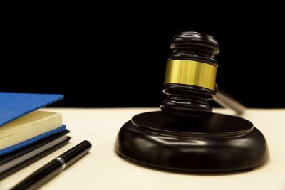 Domestic-violence-law-on-a-wooden-table_(1)