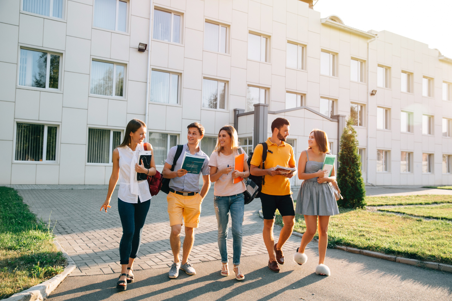 Free-time-students-bachelor-s-campus-life-rhythm-five-friendly-students-are-walking