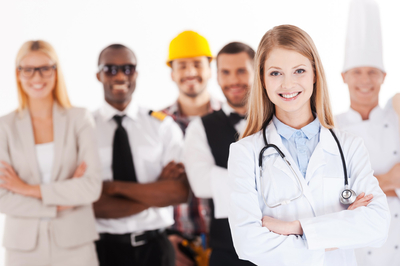 When-i-grow-up-i-will-be-a-doctor-beautiful-young-female-doctor-keeping-arms-crossed-and-smiling-while-group-of-people-in-different-professions-standing-in-the-background